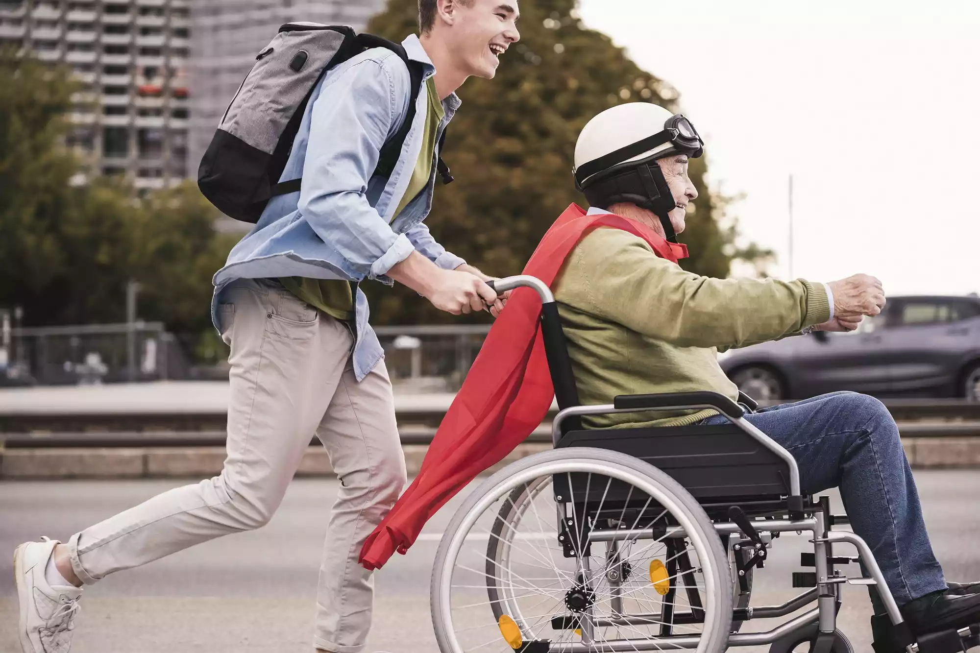 young-man-pushing-senior-man